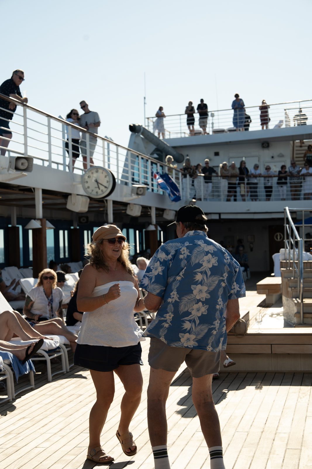 Guests dancing on deck, Explorations by Norwegian